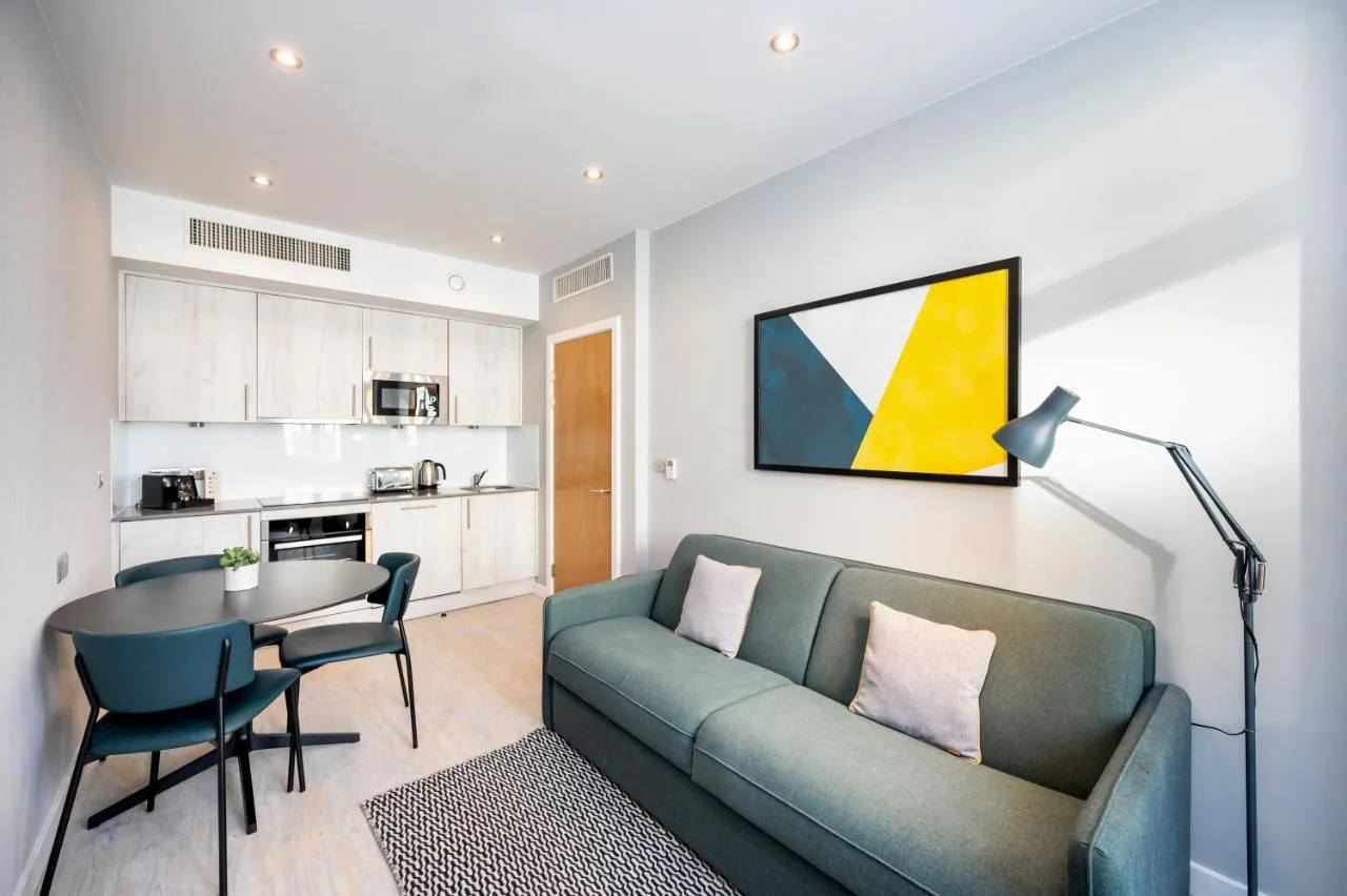 a living room with a couch and a table at Staycity Aparthotels Liverpool Waterfront in Liverpool